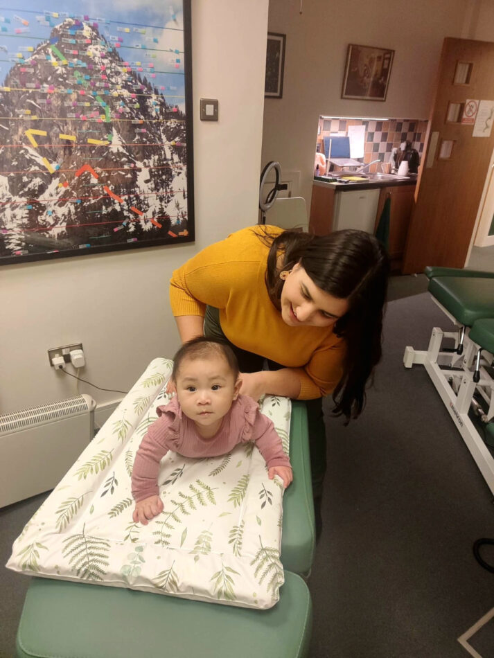baby getting chiropractic adjustment