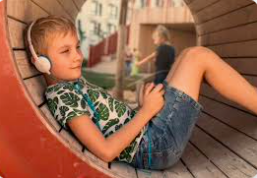 Child with autism sitting in the park